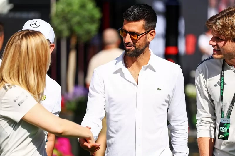 Novak Djokovic arrives in the paddock.