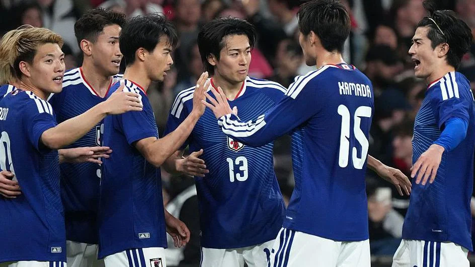 Japan players celebrate against England 