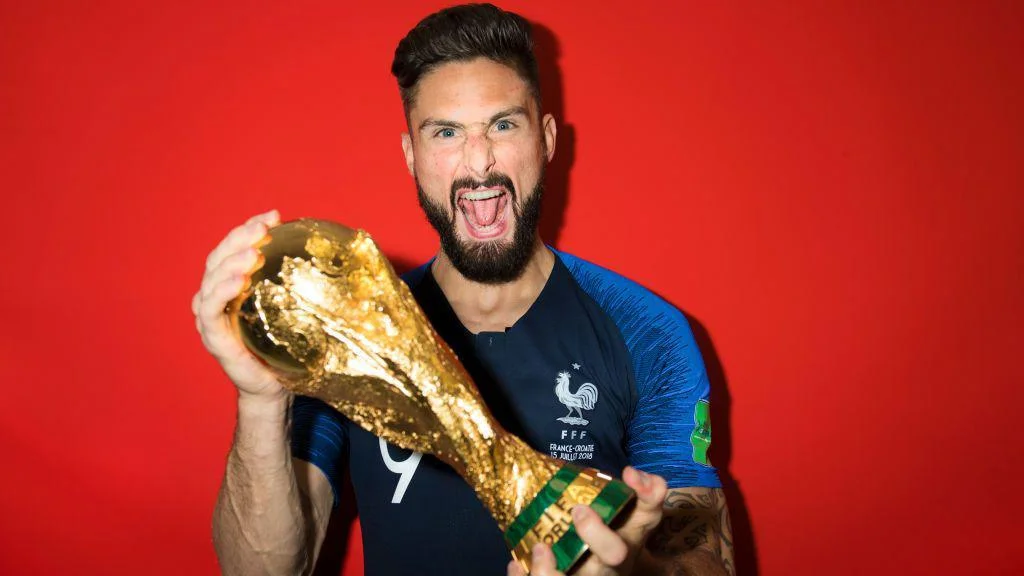 Olivier Giroud celebrates winning the World Cup trophy in 2018