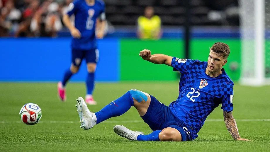 Luka Vuskovic making a slide tackle