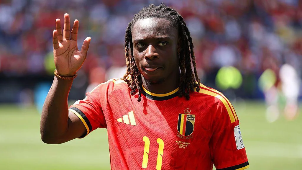 Jeremy Doku waves to the crowd while playing for Belgium