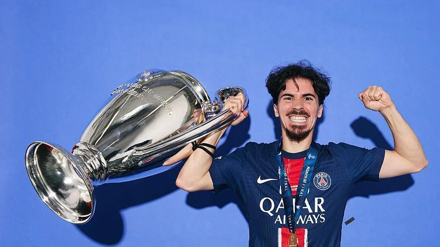 Vitinha celebrates after winning the Champions League for the second successive season