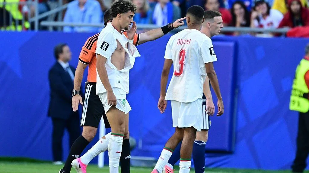 Morocco midfielder Neil El Aynaoui walks off the pitch with a torn shirt during their 2026 FIFA World Cup match against Scotland