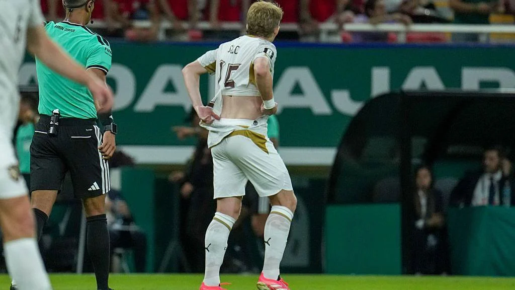 Czech Republic midfielder Pavel Sulc walks around the pitch with a torn shirt during their 2026 FIFA World Cup match against South Korea