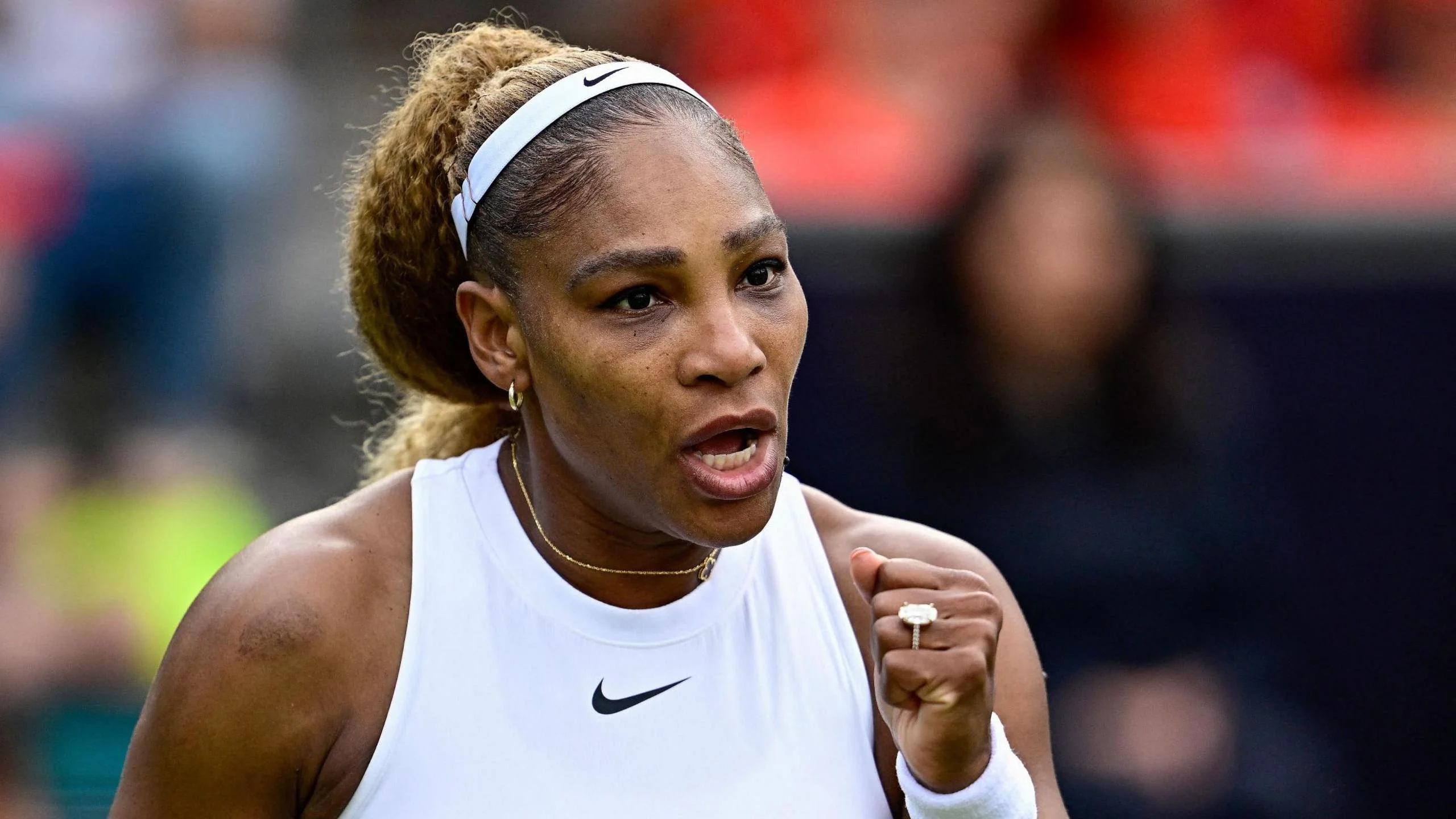 Serena Williams celebrates during a doubles match at the Berlin Open