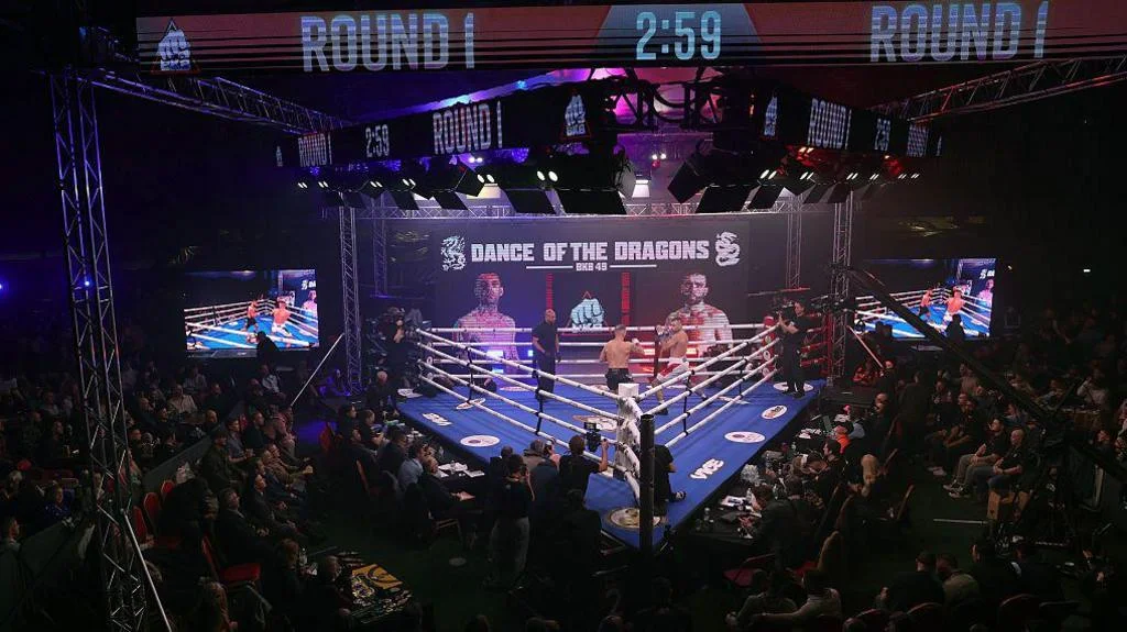Wide shot of a BKB three-sided ring at Cardiff's Vale Arena in December 2025
